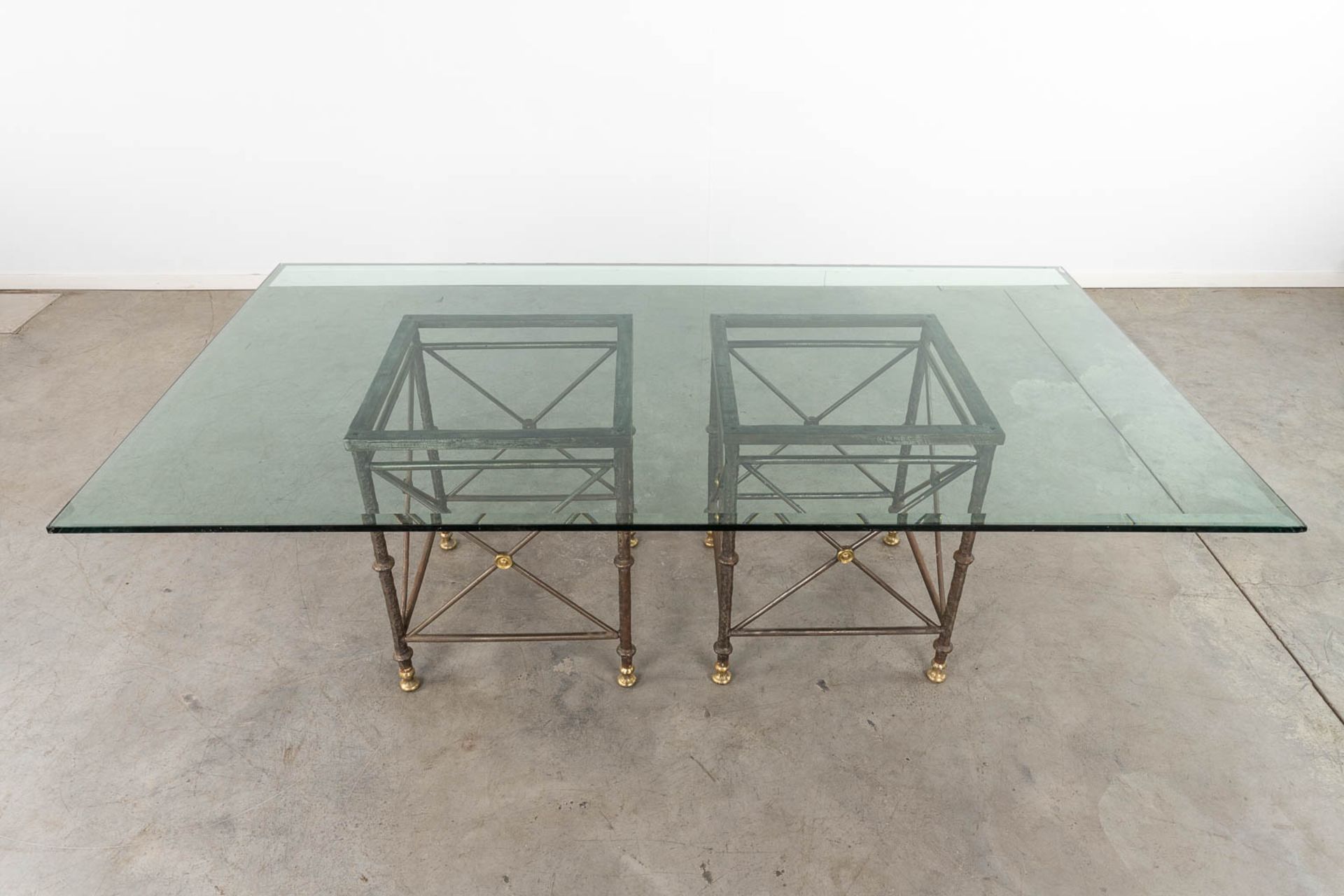 A table with large glass top and a wrought-iron and brass base. (D:120 x W:220 x H:74 cm) - Image 3 of 10