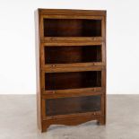 An antique English 'Barrister' bookcase, drop down glass doors. (D:30 x W:89 cm)