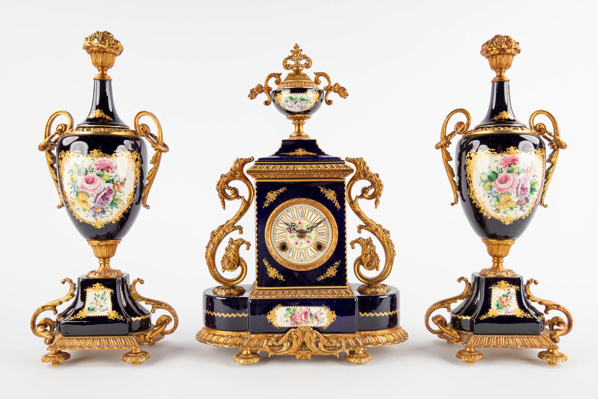 A.C.F. A three-piece mantle garniture clock and side pieces, cobalt blue porcelain mounted with bron - Image 3 of 14