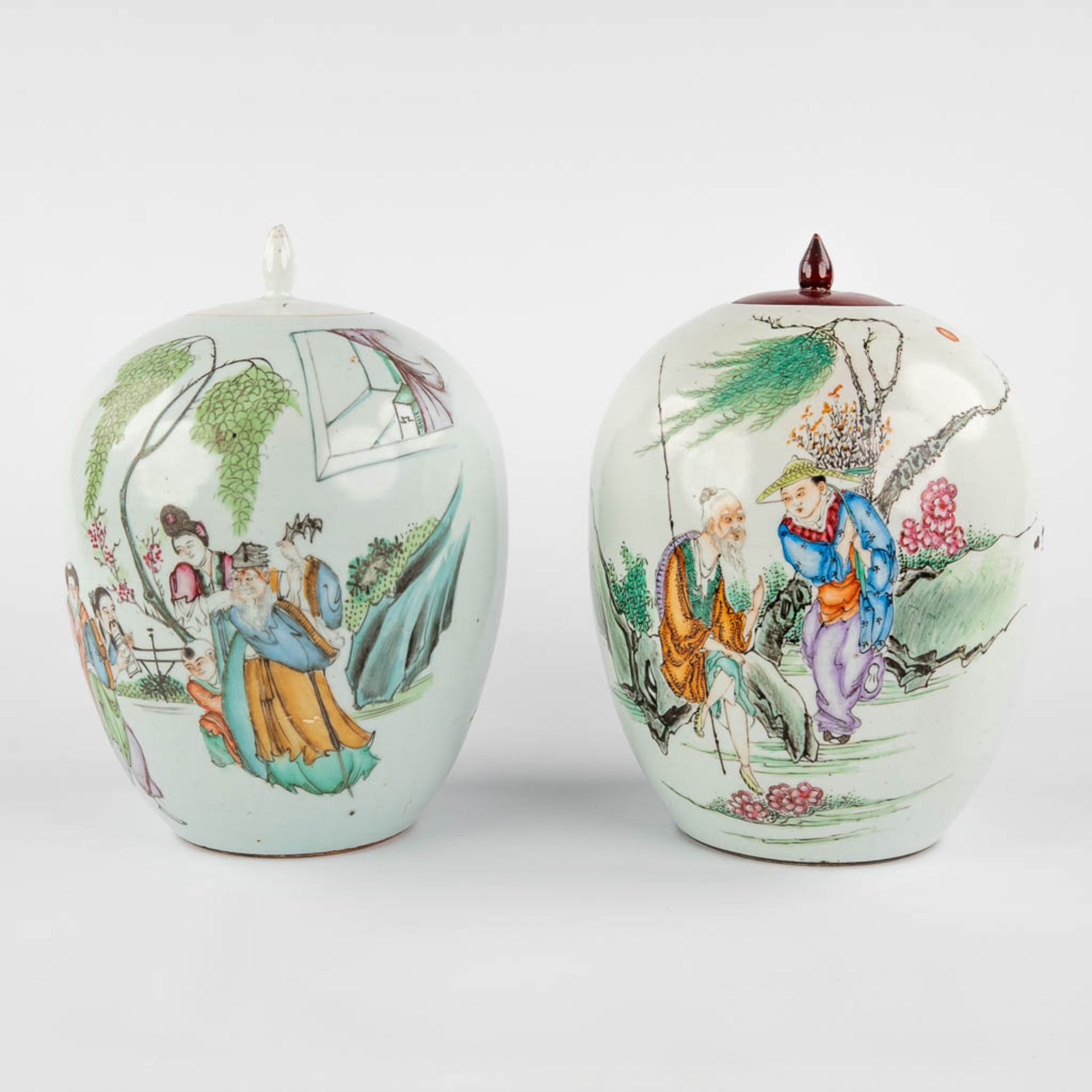 Two Chinese ginger jars, Famille Rose, decorated with wise men and fishermen. 19th/20th C. (H:30 x D