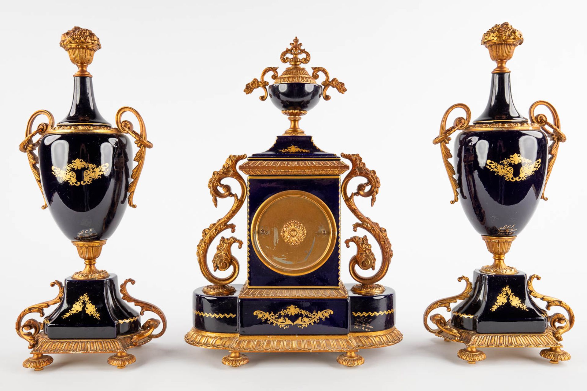 A.C.F. A three-piece mantle garniture clock and side pieces, cobalt blue porcelain mounted with bron - Image 5 of 14