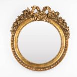 A round mirror with flowers and a ribbon in Louis XVI style. (W:66 x H:71 cm)
