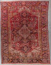 An Oriental hand-made carpet, Heriz, Iran. (D:348 x W:258 cm)