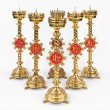 A set of 6 Church candlesticks with red IHS logo. (H:72 x D:20 cm)
