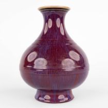 A Chinese vase with monochrome blue/purple glaze. 19th C. (H:22 x D:17 cm)