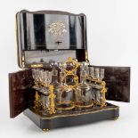An antique Cave-à-liqueur, liquor box, ebonised wood inlaid with mother of pearl and copper. 19th C.