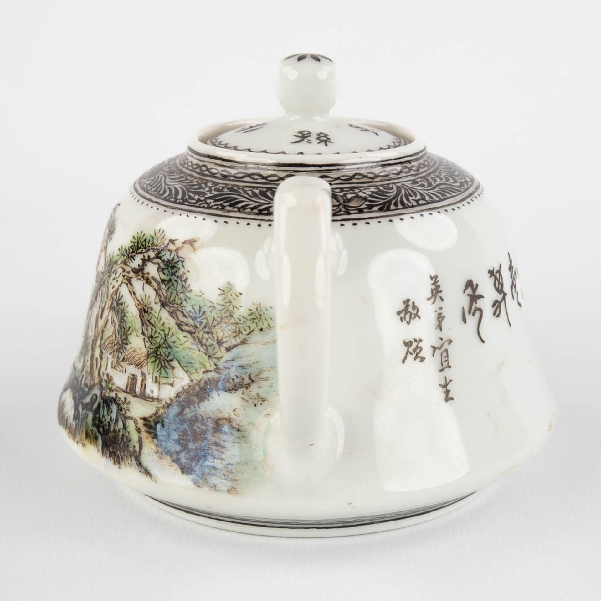 A Chinese teapot with landscape decor, 20th C. (D:11 x W:15 x H:9 cm) - Image 6 of 14