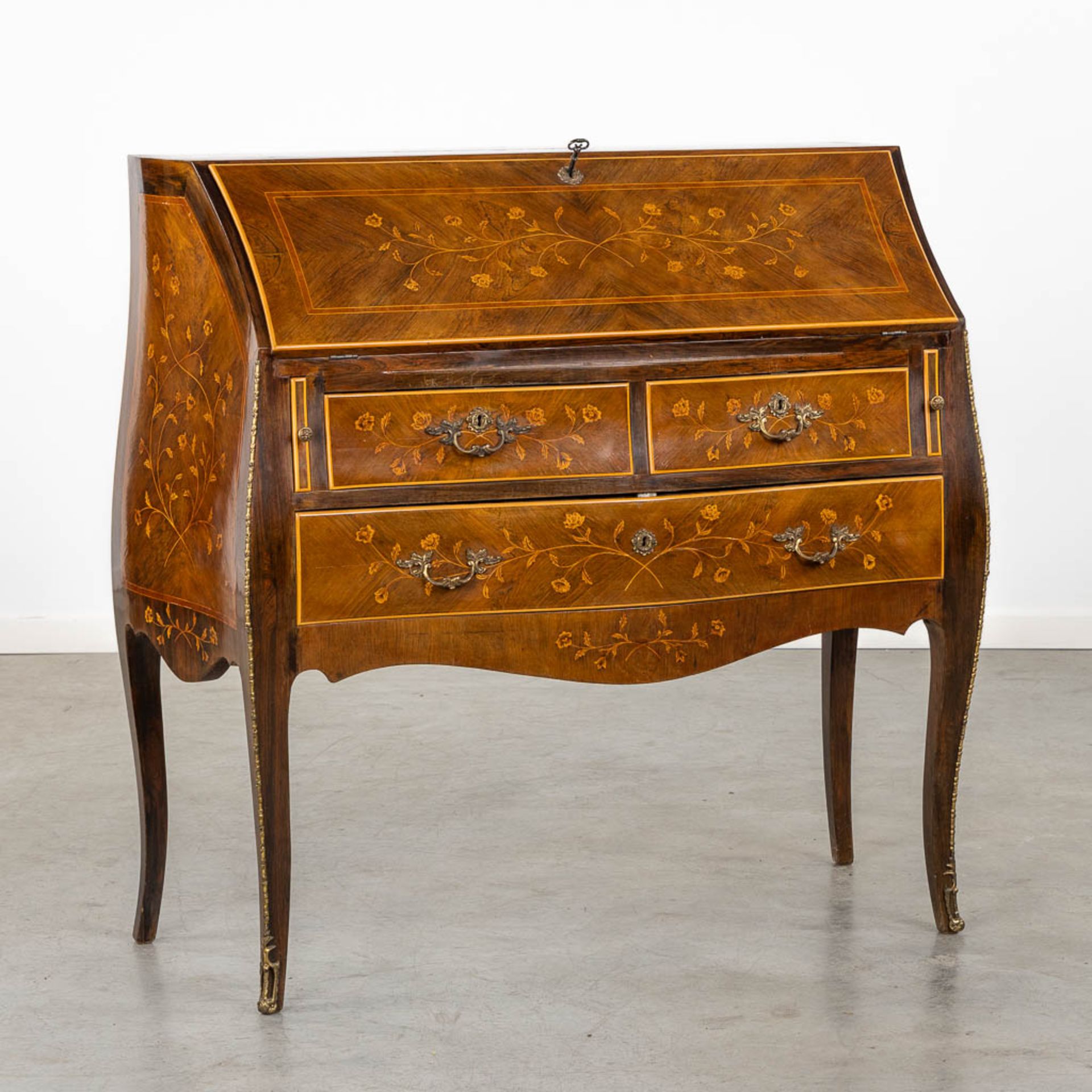 A secretaire, marquetry inlay mounted with bronze in Louis XV style. Circa 1970. (L:47 x W:101 x H:1