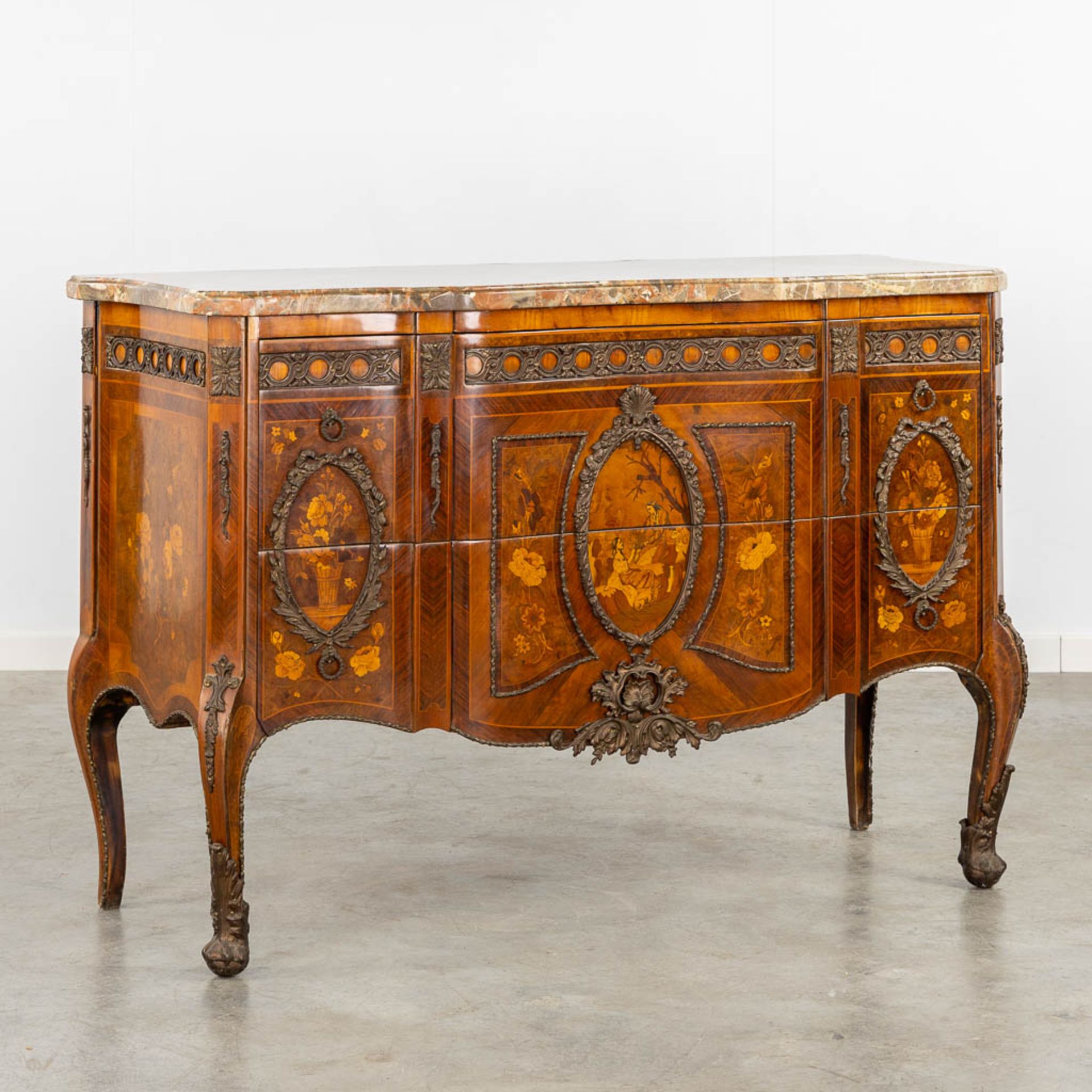 A commode with a marble top, marquetry inlay and mounted with bronze. Louis XVI style. (L:51 x W:131