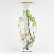 A Chinese vase decorated with fauna and flora. (H:57 x D:22 cm)