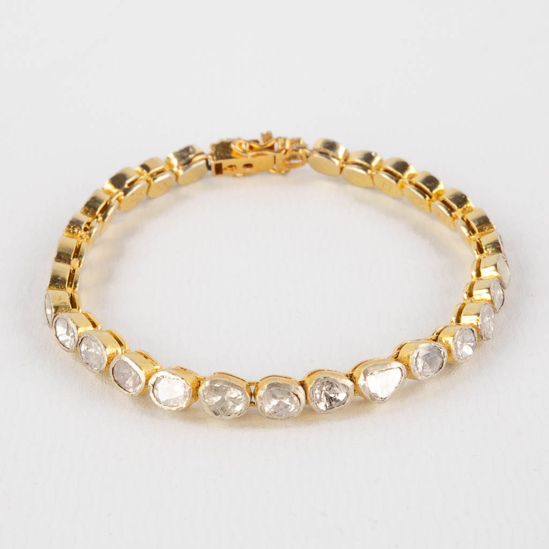 A bracelet with rough cut and flat top diamonds, in silver holders, gilt silver. 19,51g. (L:19,6 cm) - Image 6 of 12