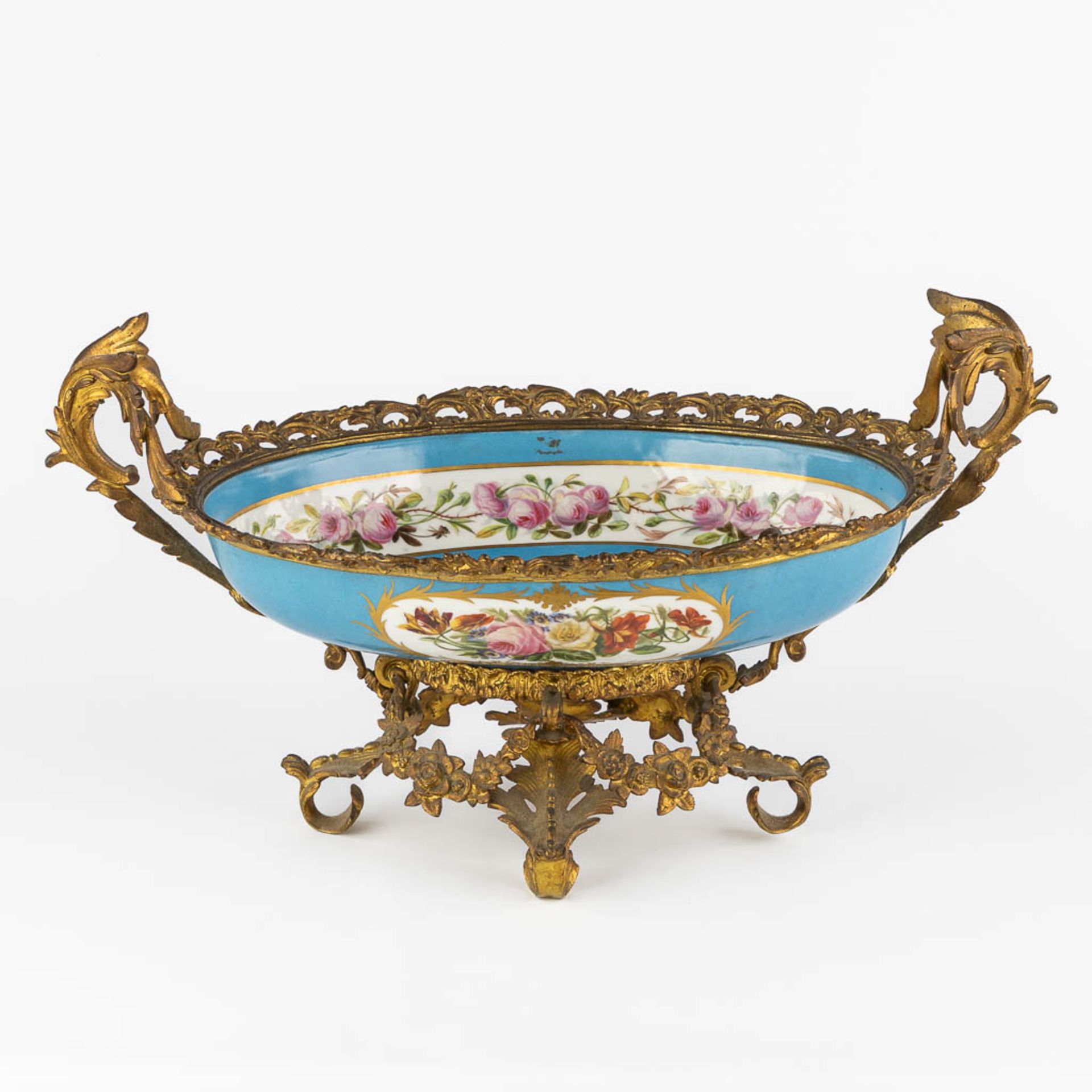 A large bowl with hand painted floral and romantic scne, mounted with gilt bronze. 19th C. (L:32 x