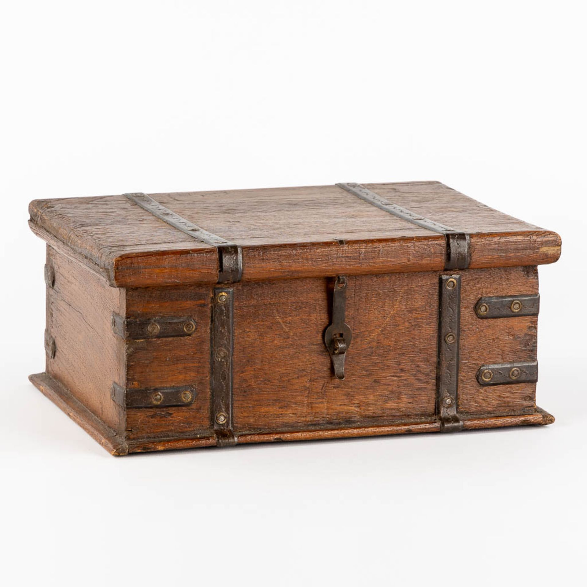 An antique money box or storage chest, oak and wrought iron, 19th C. (L:23 x W:31 x H:13 cm)