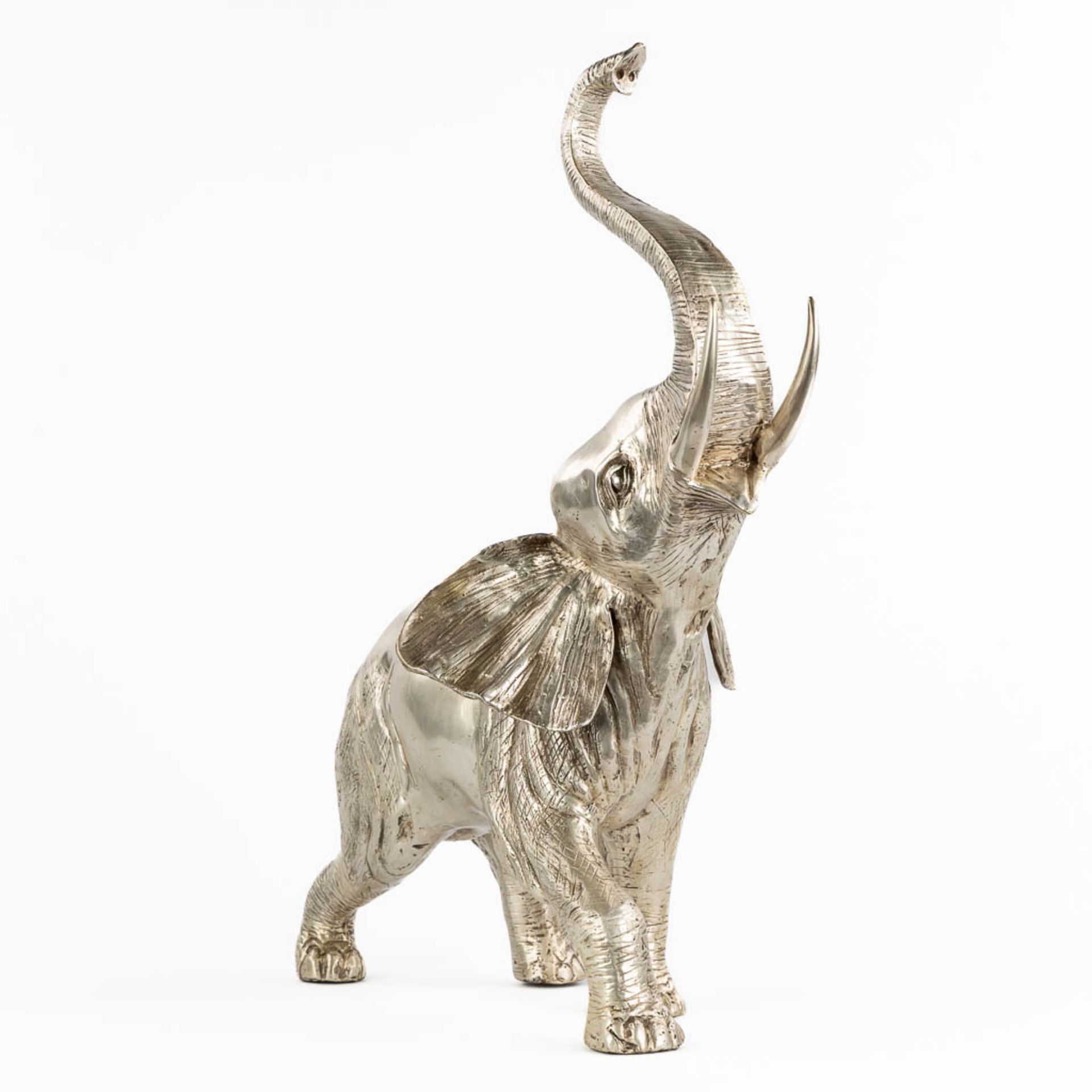 A large figurine of an elephant, silver-plated bronze. (L:28 x W:48 x H:64 cm)