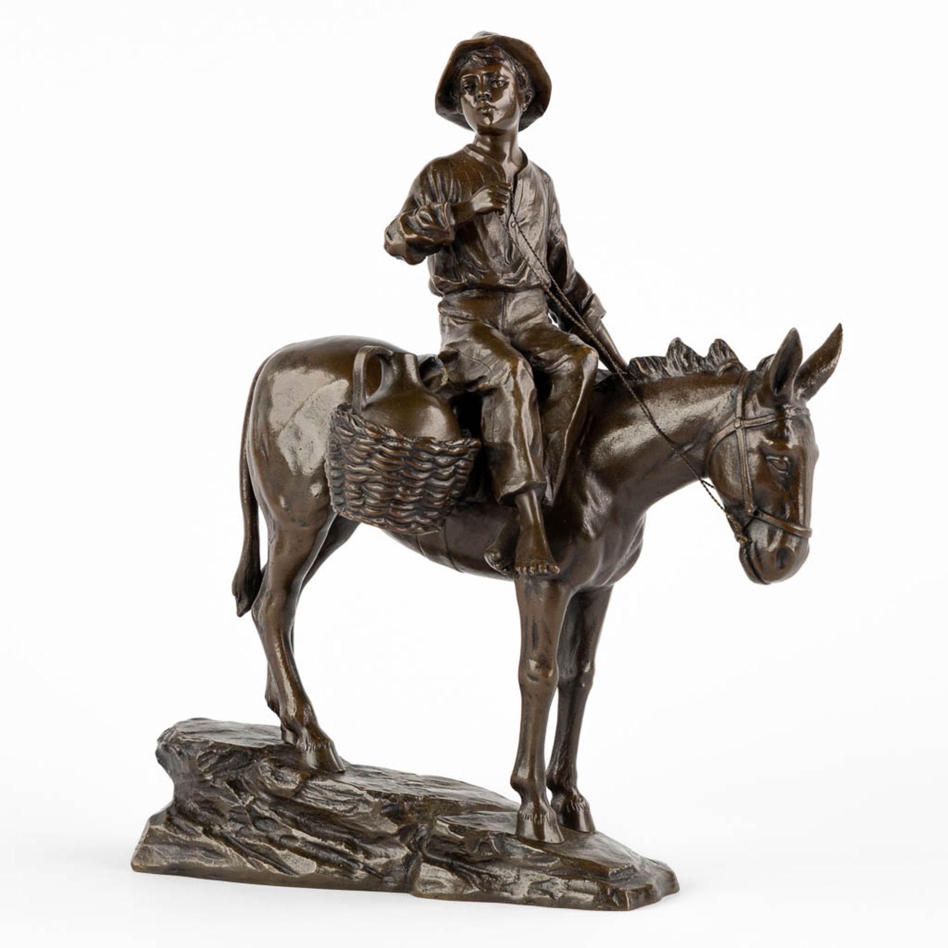A small figurine of a young man riding a donkey, patinated bronze. Circa 1900. (L:18 x W:28 x H:33 c