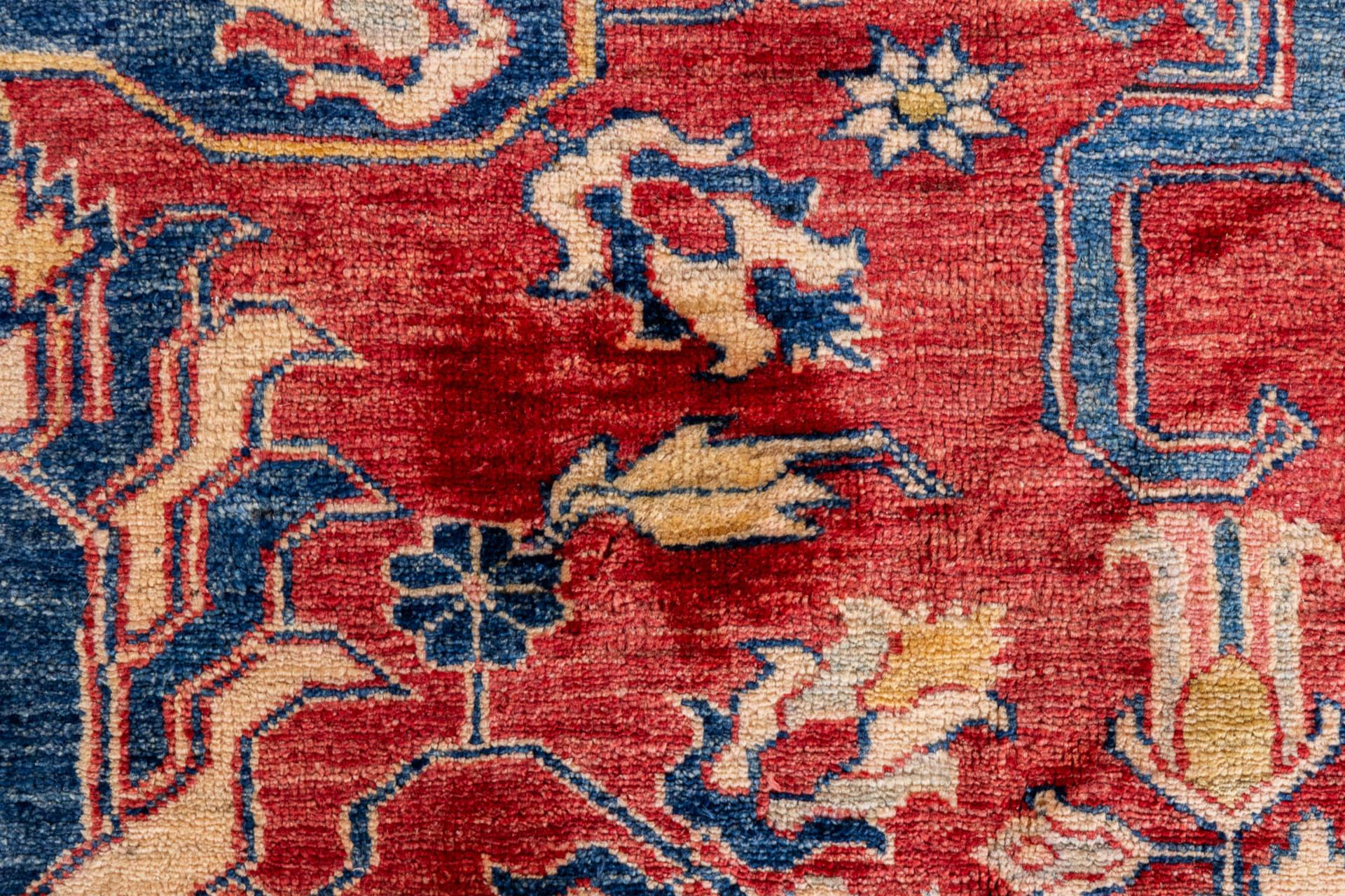 A large Oriental hand-made carpet, Ghazhi, Afganistan. (L:312 x W:455 cm) - Image 7 of 13