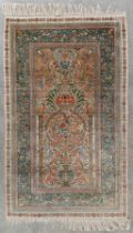 An Oriental hand-made silk carpet, Isfahan. (L:153 x W:92,5 cm)