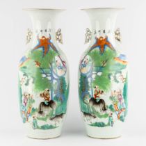 A pair of Chinese vases, decorated with playing children and kaligraphic texts. (H:59 x D:23 cm)