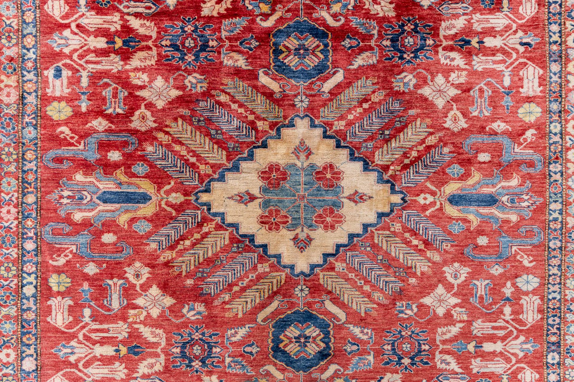 A large Oriental hand-made carpet, Ghazhi, Afganistan. (L:312 x W:455 cm) - Image 3 of 13