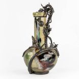 A glass vase mounted with sculptural cast iron, in the style of Louis Van Boeckel. (H:67 x D:33 cm)