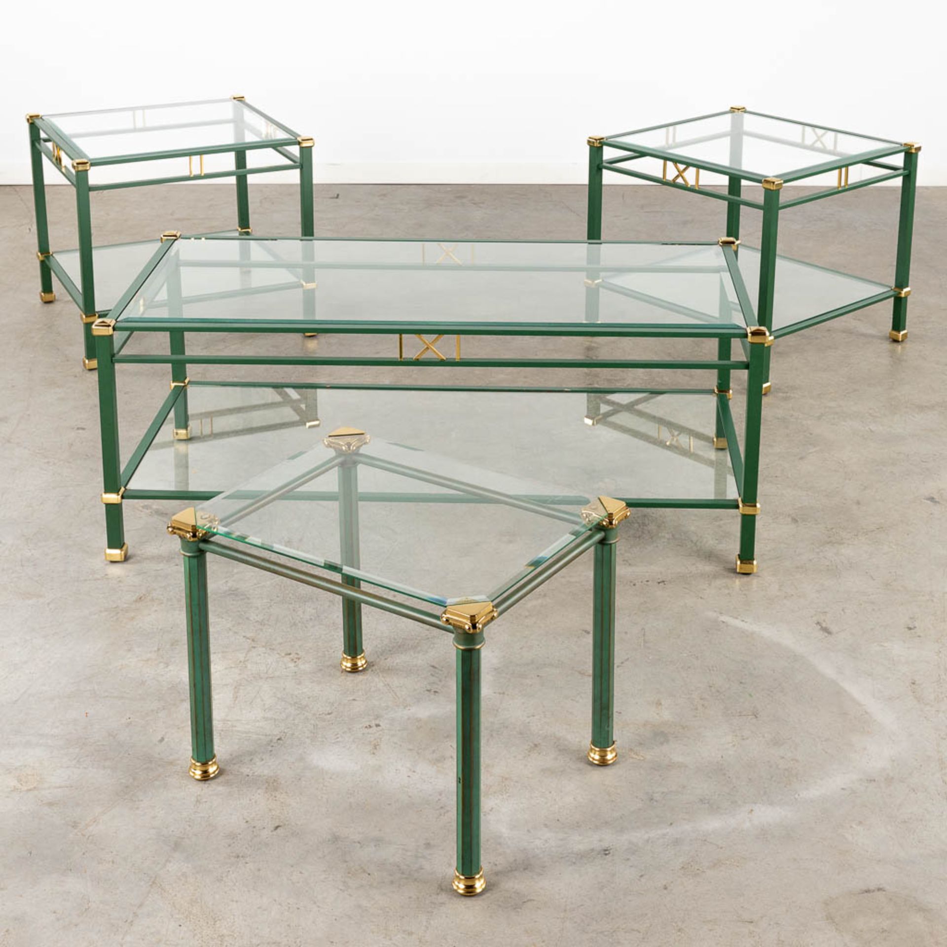4 matching coffee and side tables, lacquered metal and glass, circa 1980. (L:58 x W:118 x H:46 cm)