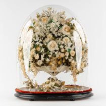 An exceptionally large 'Bridal Bouquet', standing under a glass dome. Circa 1900. (L:33 x W:55 x H:6