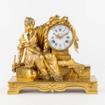 A mantle clock, gilt bronze. The second half of the 20th C. (L:15 x W:37 x H:33 cm)