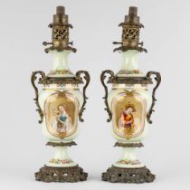 A pair of oil lamps with hand-painted decors, mounted with bronze. 19th C. (L:18 x W:20 x H:57 cm)