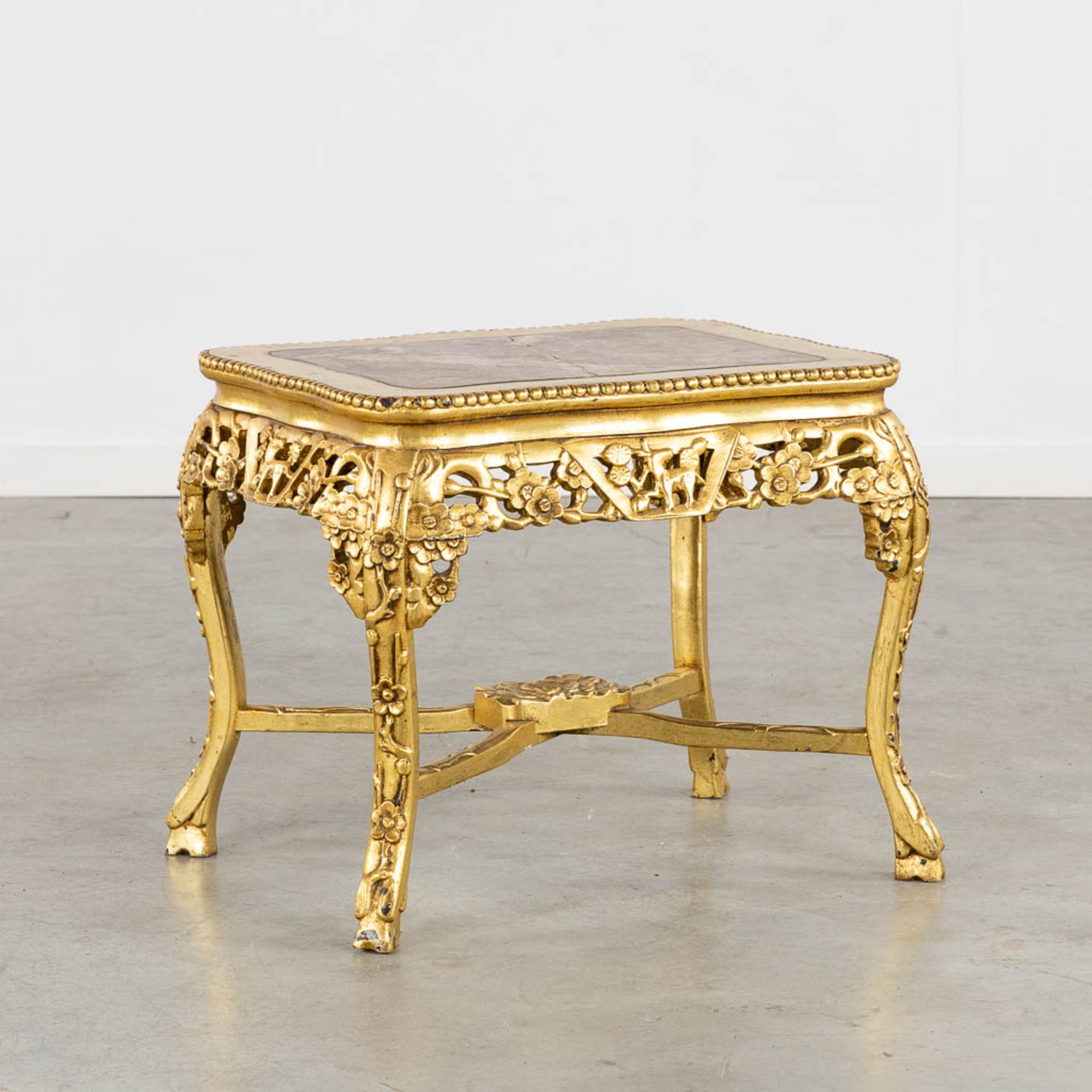 An oriental style side table, gilt wood with a marble top. (L:46 x W:52 x H:48 cm)