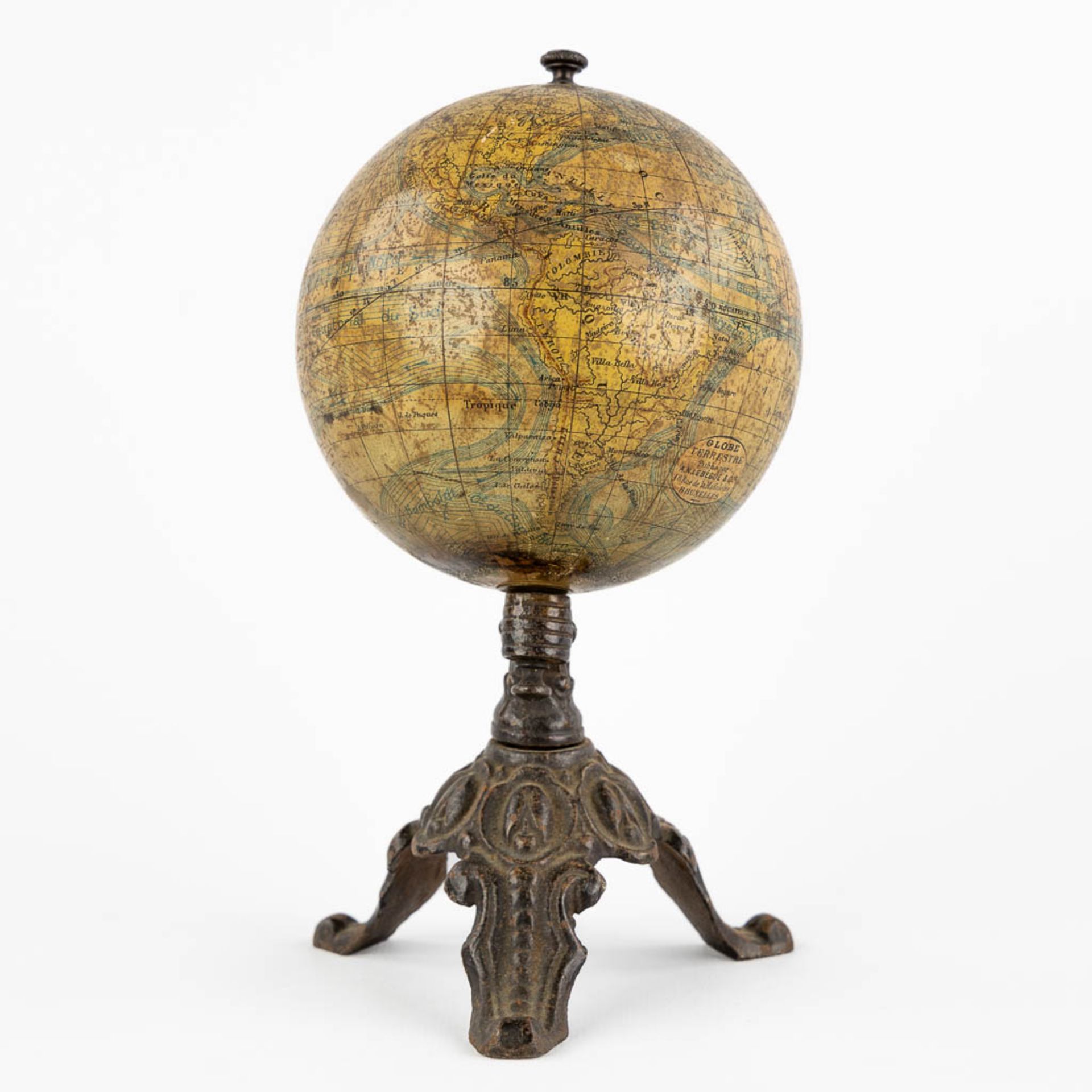 J. Lebegue & Cie, an antique globe on a cast-iron base. Circa 1900. (H:19 x D:10 cm)