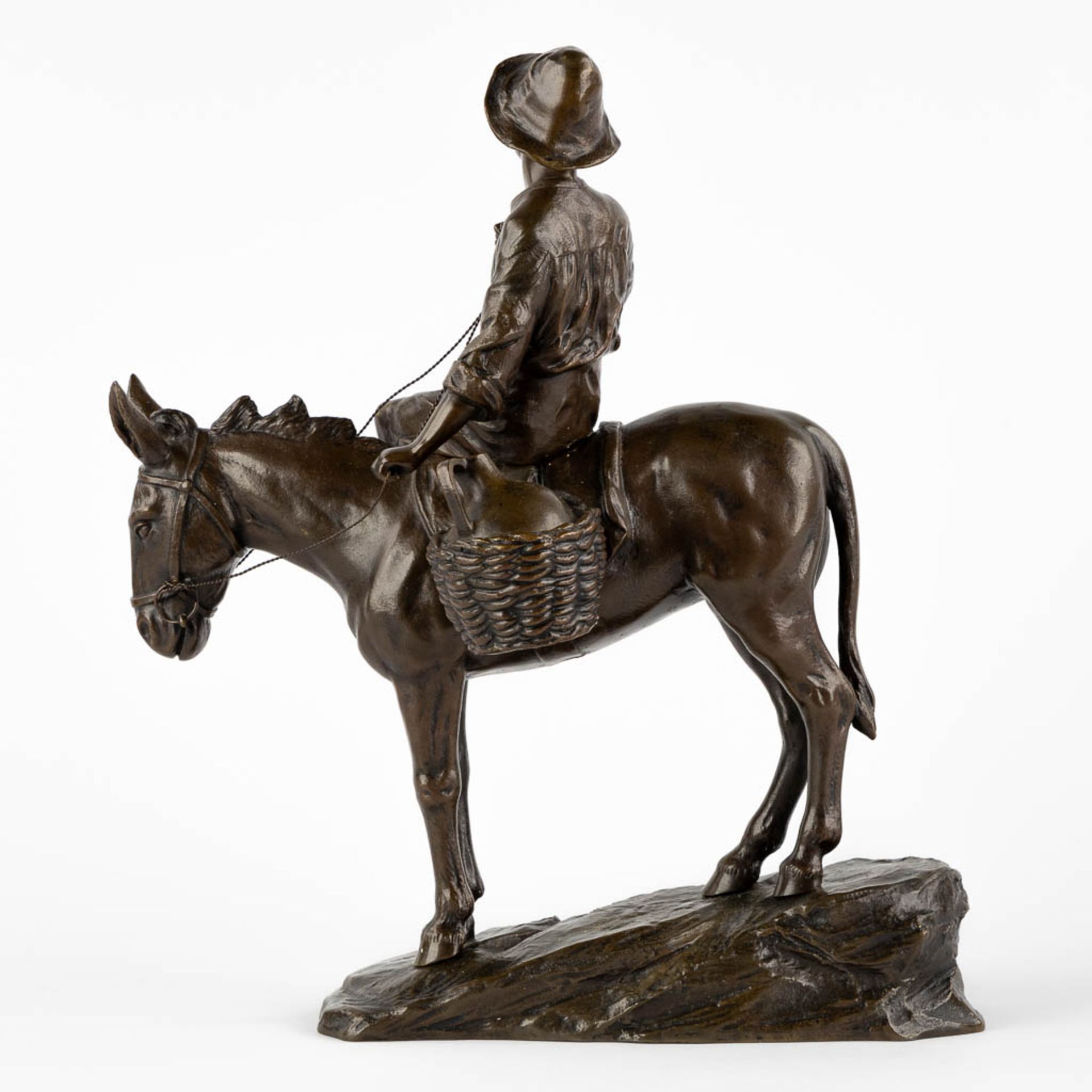 A small figurine of a young man riding a donkey, patinated bronze. Circa 1900. (L:18 x W:28 x H:33 c - Image 5 of 10