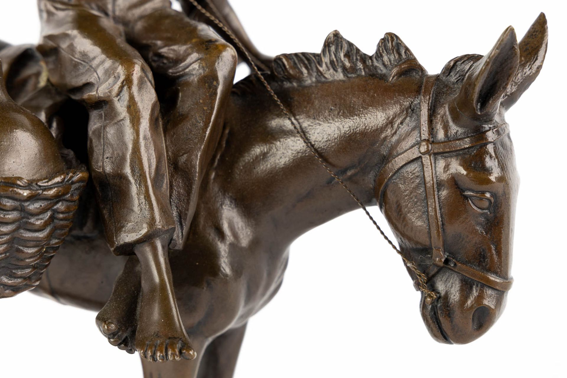 A small figurine of a young man riding a donkey, patinated bronze. Circa 1900. (L:18 x W:28 x H:33 c - Image 9 of 10