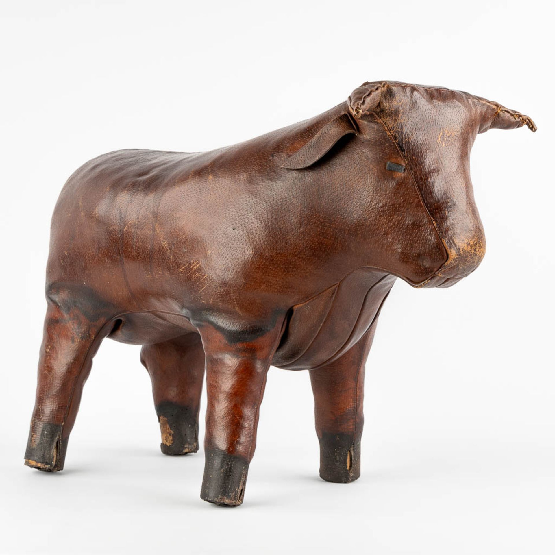 Dimitri OMERSA (1927-1975) 'Bull' a leather footstool. (L:33 x W:58 x H:46 cm)