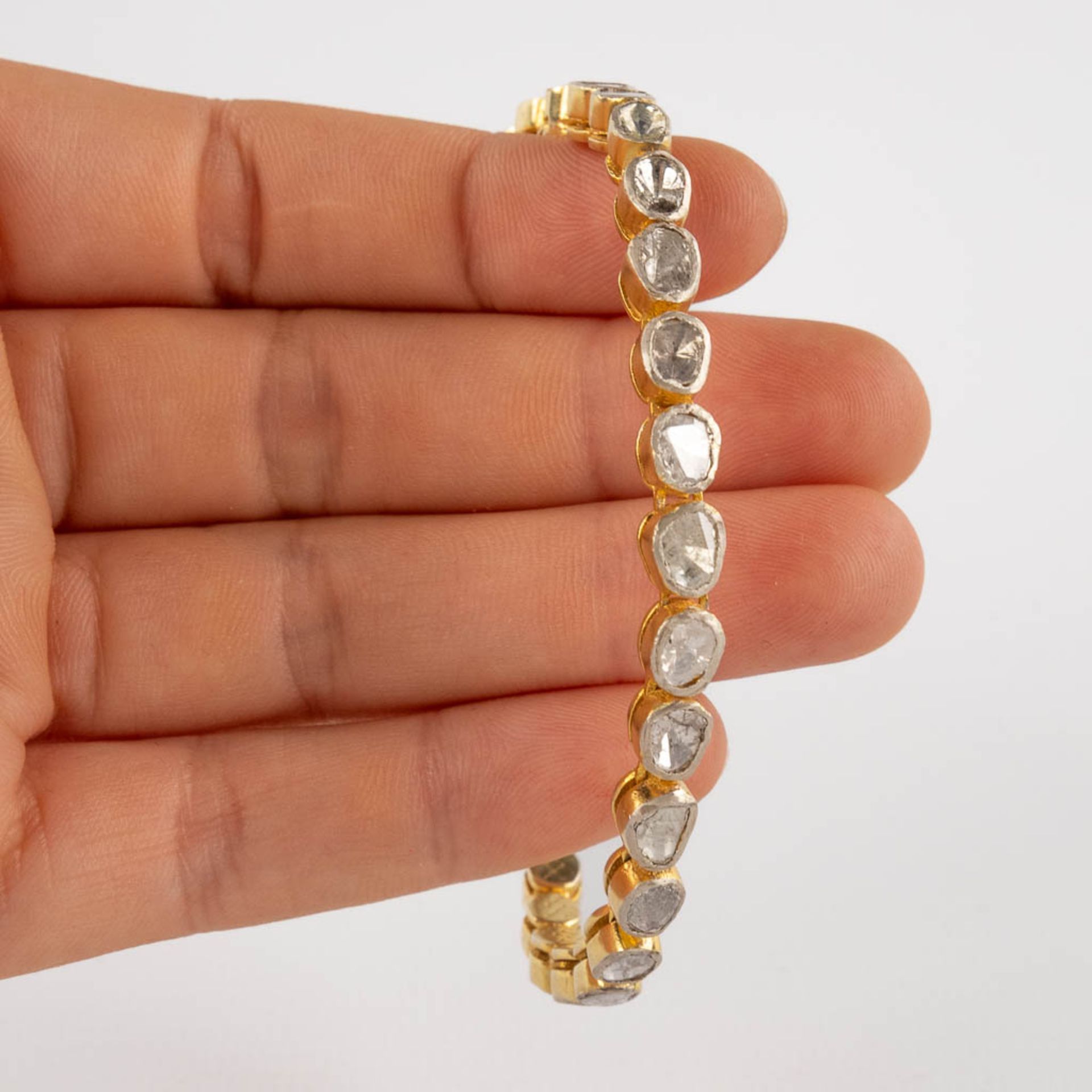 A bracelet with rough cut and flat top diamonds, in silver holders, gilt silver. 19,51g. (L:19,6 cm) - Image 11 of 12