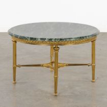 A brass coffee table with a green marble top. (H:46 x D:80 cm)
