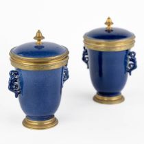 A pair of Chinese vases with a lid, blue glaze, mounted with gilt bronze. 19th C. (L:11 x W:14 x H:1