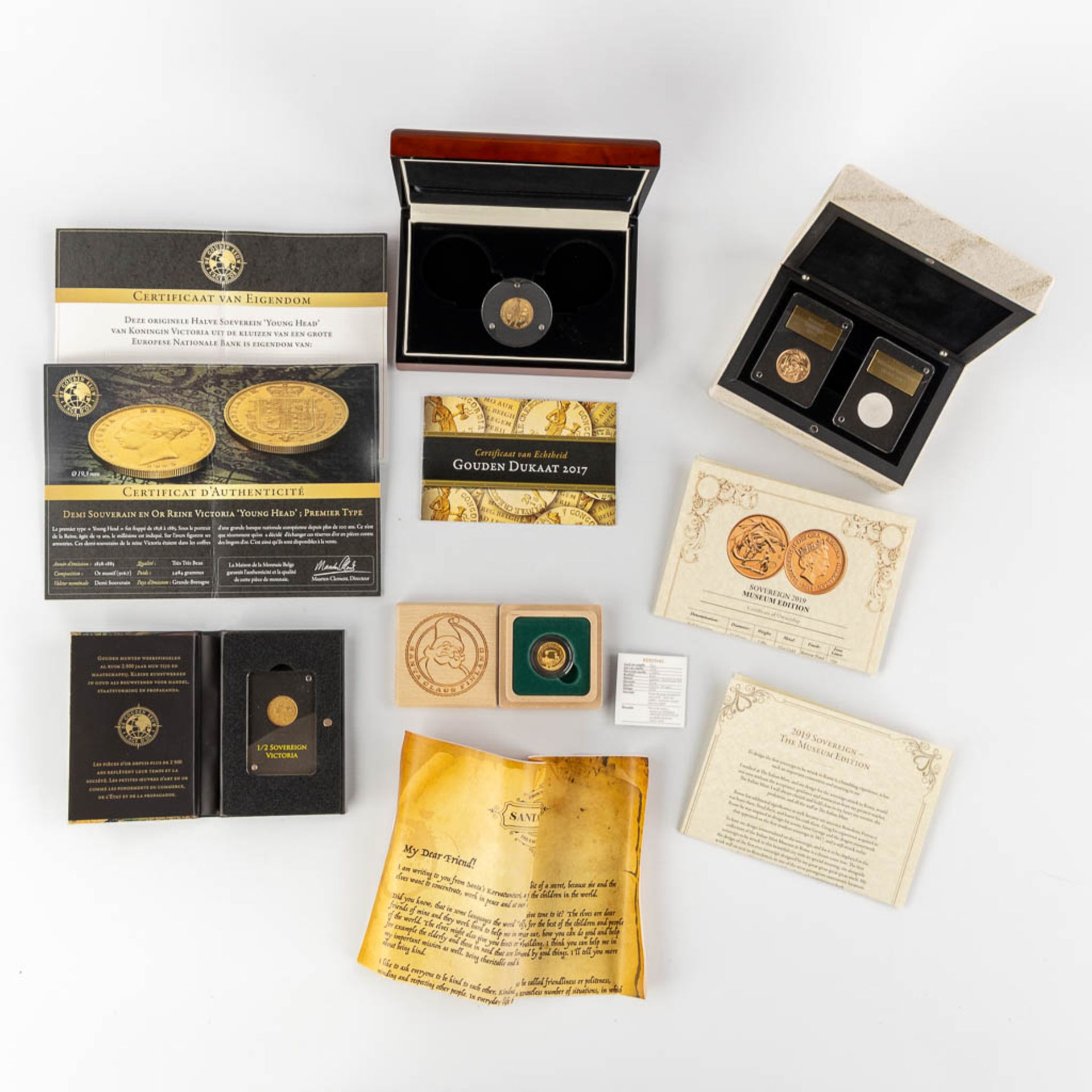 4 gold coins in storage boxes, Museum Sovereign 2019, 1/2 Sovereign Victoria, Ducat D'Or 2017, Santa