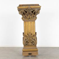 A richly gilt and woodsculptured pedestal with an ionic capitel. Circa 1900. (L:44 x W:60 x H:130 cm