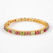 A bracelet mounted with multiple coloured 'Tourmalines' en 'Old Cut' diamonds, gilt silver. 18,57g.