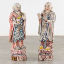 A pair of decorative wood-sculptured figurines of temple guards. 20th C. (L:30 x W:30 x H:100 cm)