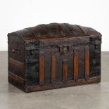 A large and antique chest decorated with leather and metal. (L:48 x W:95 x H:65 cm)