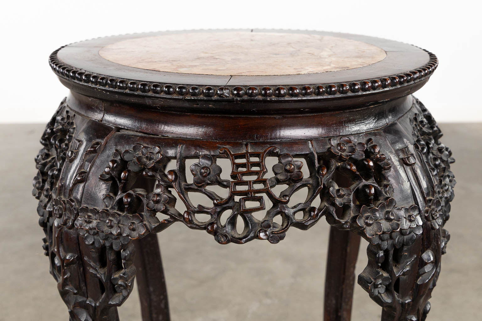 A richly sculptured Chinese hardwood side table or pedestal with a marble. (H:71 x D:53 cm) - Image 9 of 12