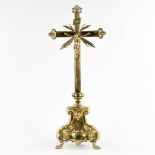 A large crucifix, brass, the second half of the 19th C. (L:22 x W:34 x H:83 cm)