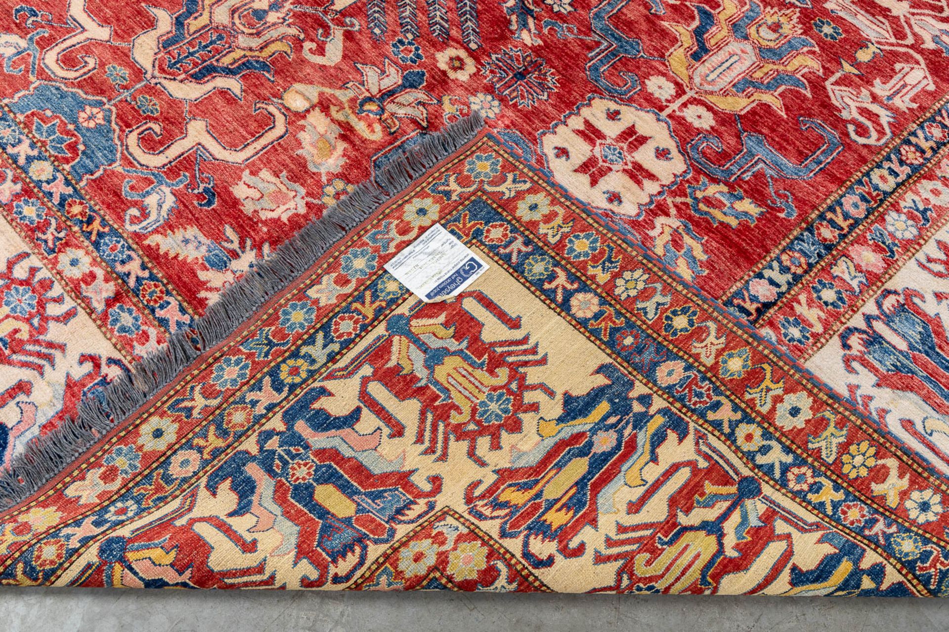 A large Oriental hand-made carpet, Ghazhi, Afganistan. (L:312 x W:455 cm) - Image 12 of 13