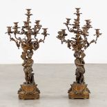 An exceptionally large pair of candelabra, decorated with putti. 19th C. (H:99 x D:49 cm)
