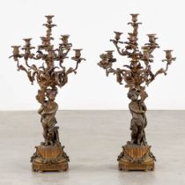 An exceptionally large pair of candelabra, decorated with putti. 19th C. (H:99 x D:49 cm)