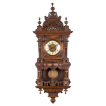 An antique wood-sculptured wall clock in the style of Lenzkrich. (L:21 x W:45 x H:114 cm)