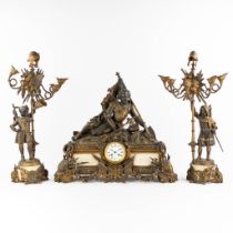 A large three-piece mantle garniture clock, decorated with knights. Bronze and marble. Circa 1900. (