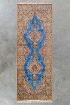 An Oriental hand-made carpet, Silk, Kirman. (L:276 x W:102 cm)