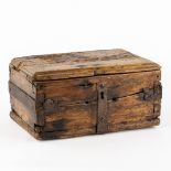 An antique money box or storage chest, wood and wrought iron, 16th/17th C. (L:24 x W:34 x H:17 cm)